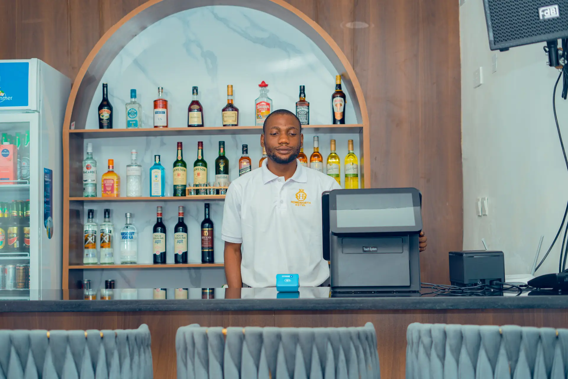 Picture showing the bartender at Homeworth Hotel